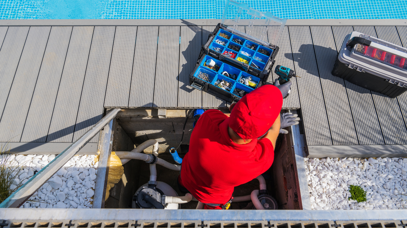 maintenance man fixing pool