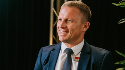 Decoding Success: An Interview with a 2024 REB Top Agent, Dane Queenan cover