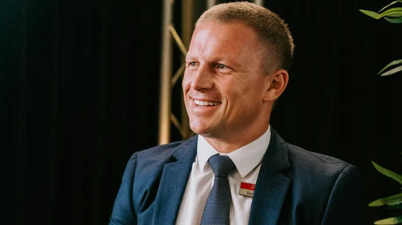 Decoding Success: An Interview with a 2024 REB Top Agent, Dane Queenan