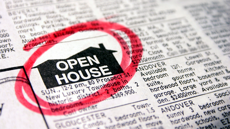 newspaper ad saying open house with red circle