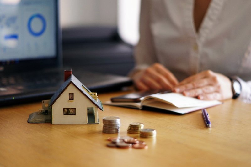 woman sitting with house savings